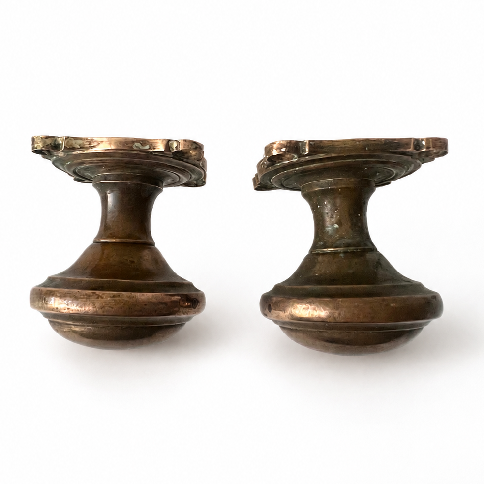 Pair of heavy antique cast brass door knobs with round handles, square backplates