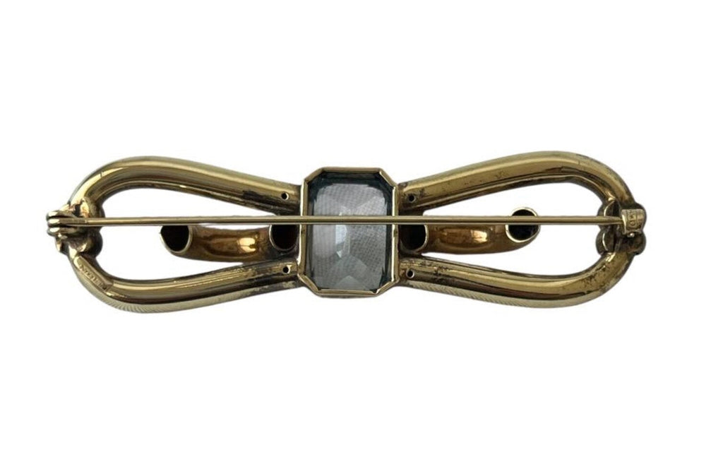 Vintage Amerikaner Brooch Gold Plated Bow Pin With Light Blue Faceted Stone